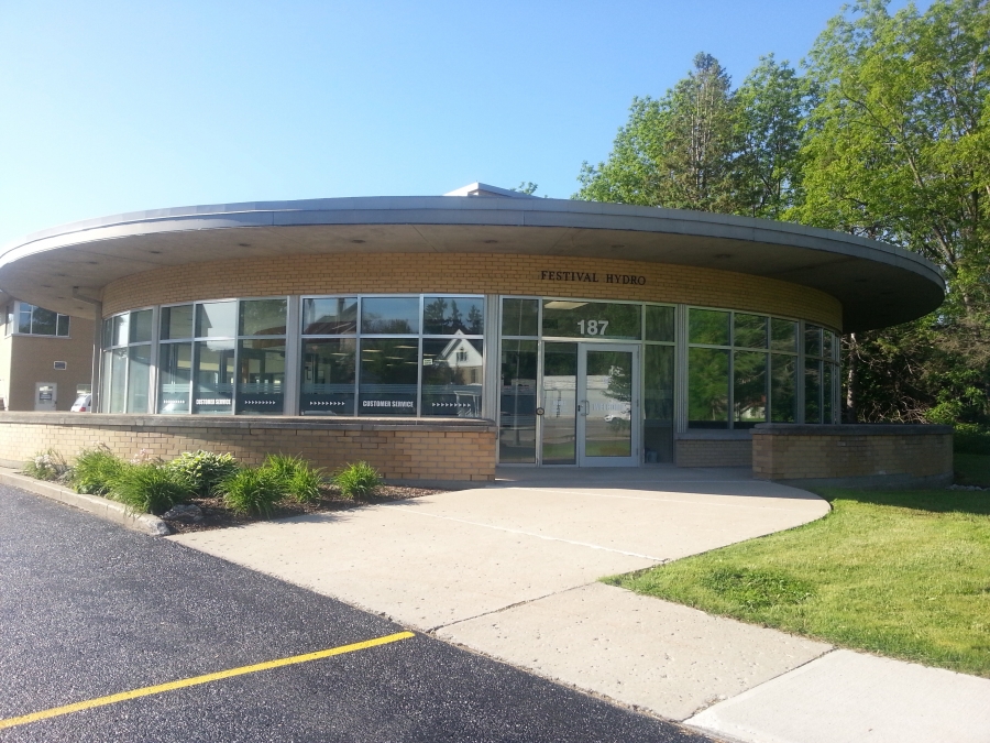 front of building The Festival Hydro building's front entrance is a rounded front with double entrance doors labelled customer servcie entrance.